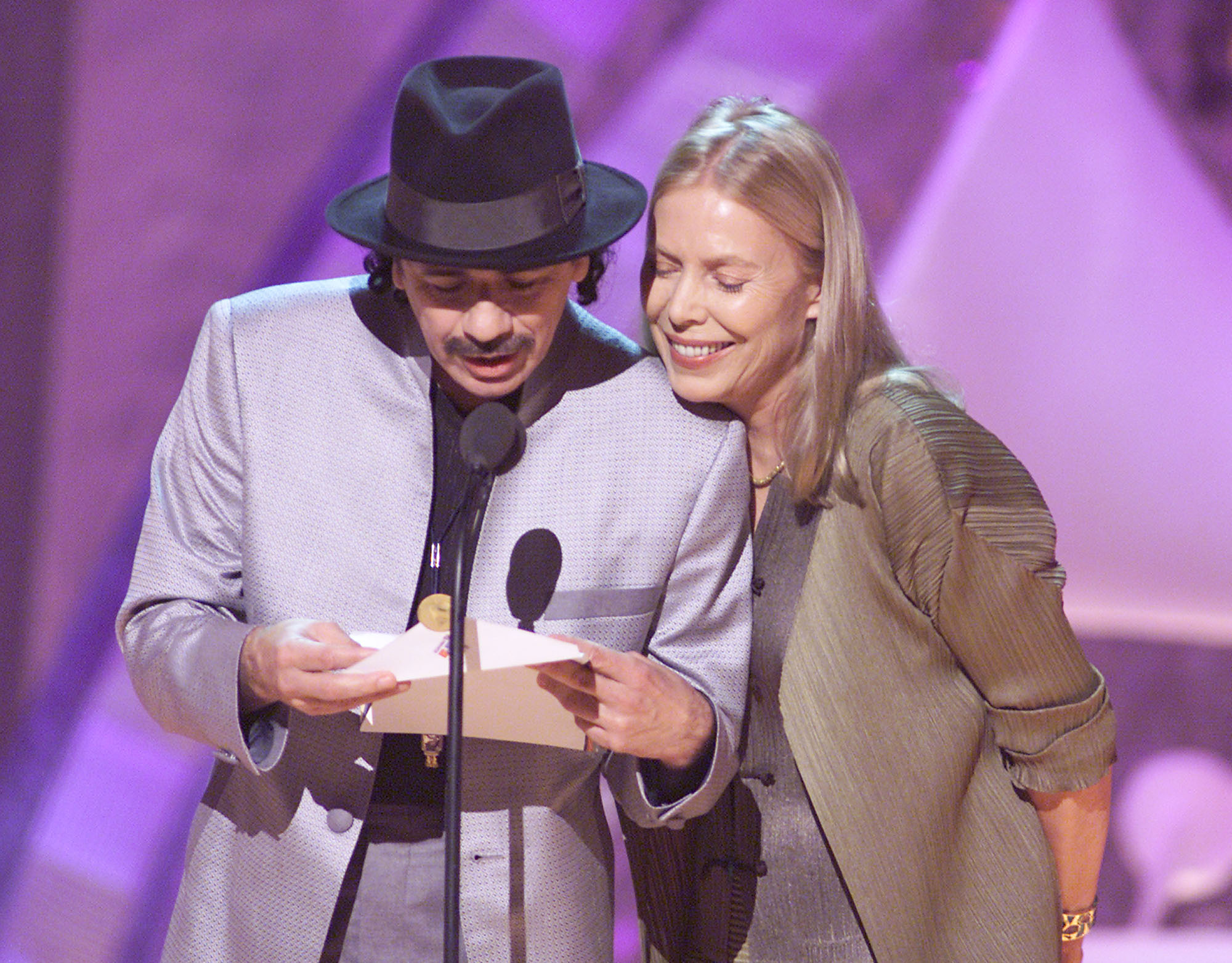 Carlos Santana and Joni Mitchell at the 43rd Annual Grammy Awards broadcast at Staples Center in Los Angeles, CA on February 21, 2001. (Getty)