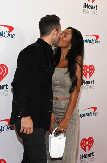 Zac Clark and Tayshia Adams kiss.