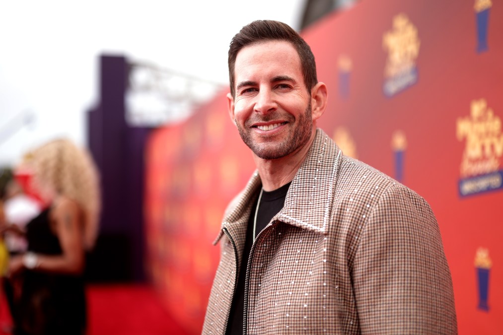 Tarek El Moussa smiles for a photo