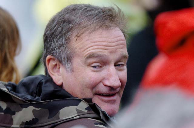 US actor Robin Williams smiles as he arr