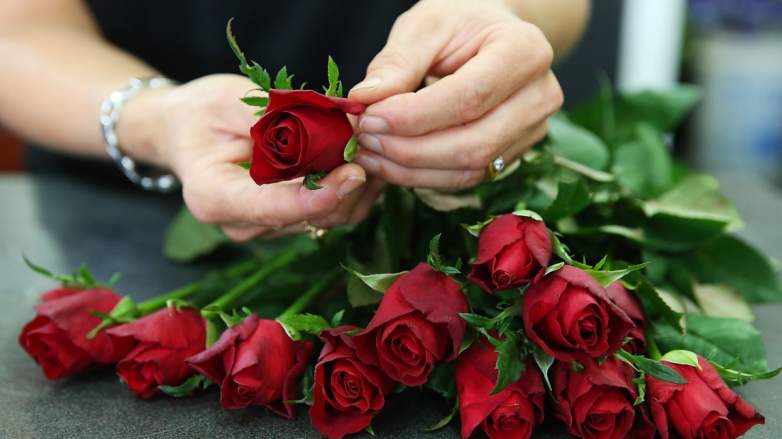 A woman with red roses.
