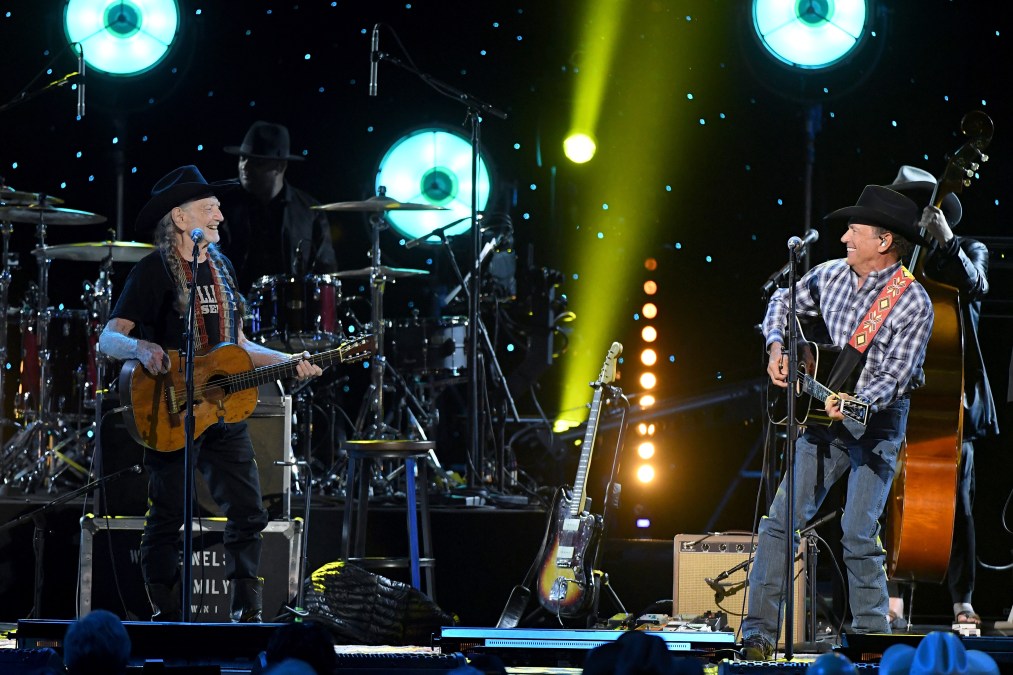 George Strait and Willie Nelson perform together