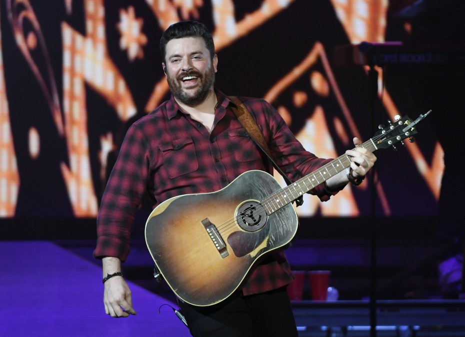 Chris Young holding a guitar
