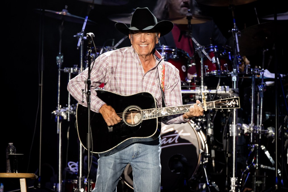 George Strait playing guitar
