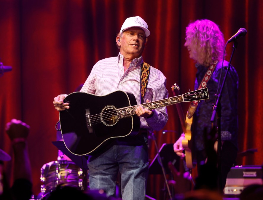 George Strait holding a guitar