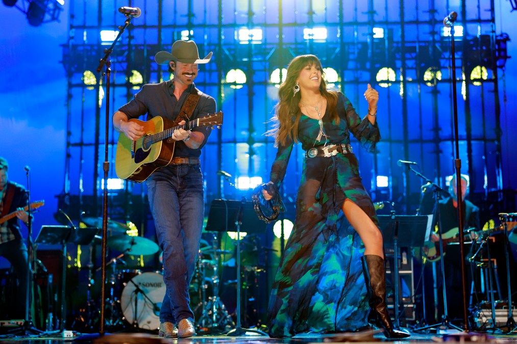 Riley Green and Ella Langley performing on stage