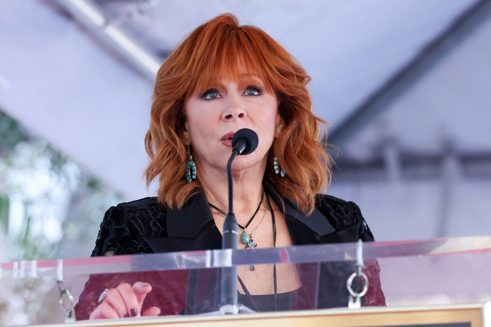 Reba McEntire speaking into a microphone