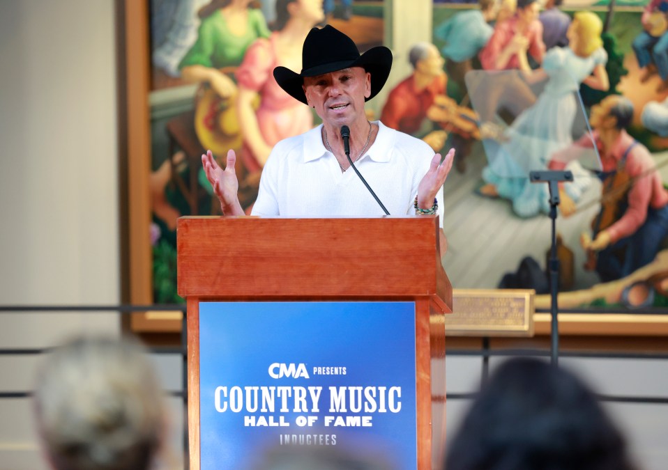 Kenny Chesney speaking at a podium