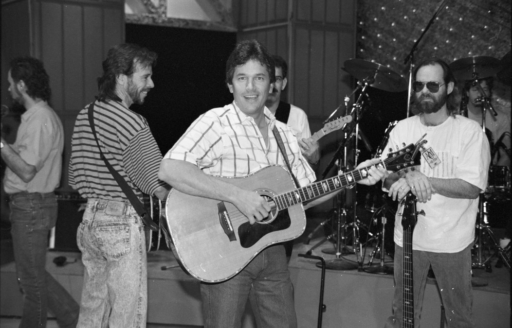 George Strait playing guitar